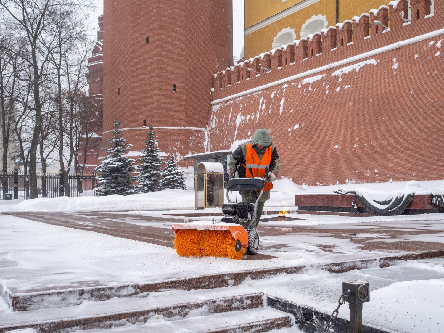 utility-worker-cleans-snow-with-snowplow-grave-unknown-soldier-kremlin-during-snowfall